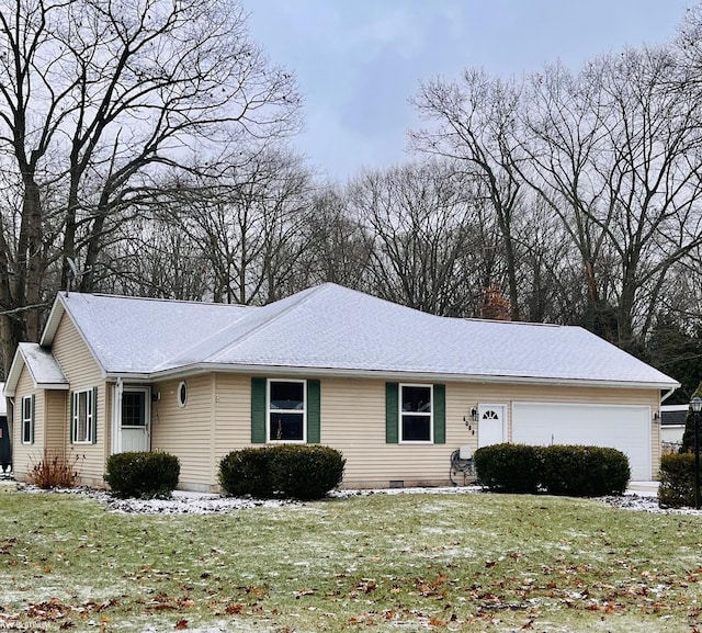 ranch-style home with a front yard and a garage