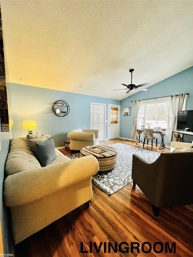 living room with lofted ceiling, ceiling fan, a textured ceiling, and hardwood / wood-style flooring