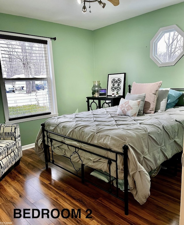 bedroom featuring dark wood-type flooring