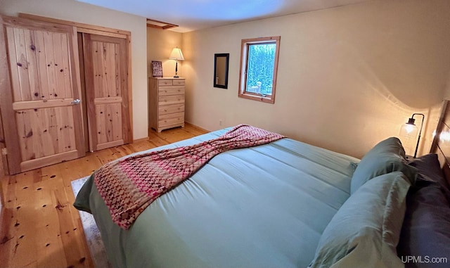 bedroom with light hardwood / wood-style floors