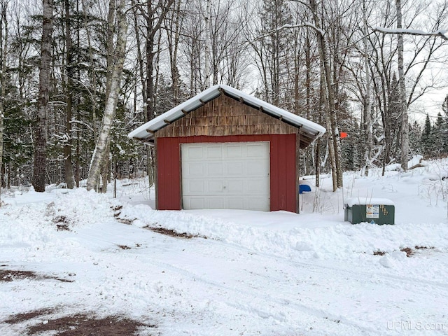 view of snow covered garage