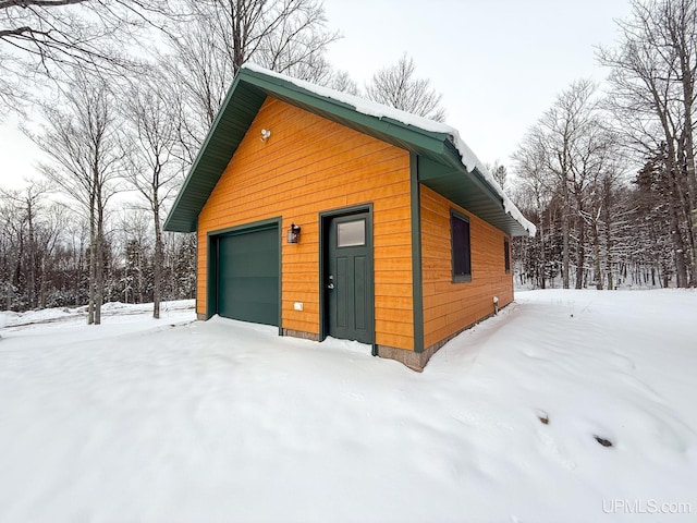 view of snow covered garage