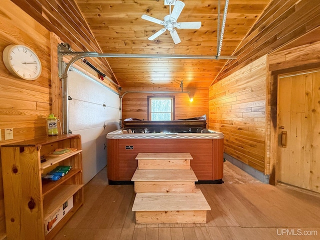 interior space featuring wood walls, wooden ceiling, and vaulted ceiling