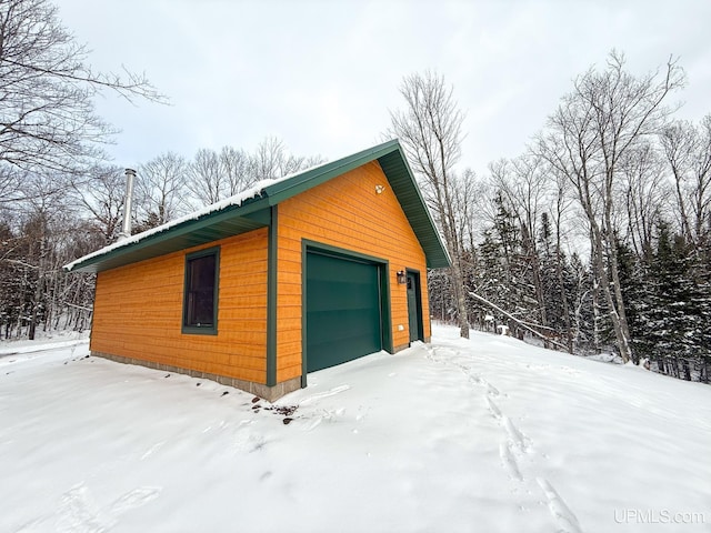 view of snow covered garage