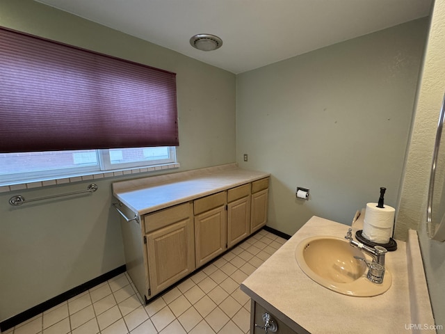 bathroom with tile patterned floors and sink