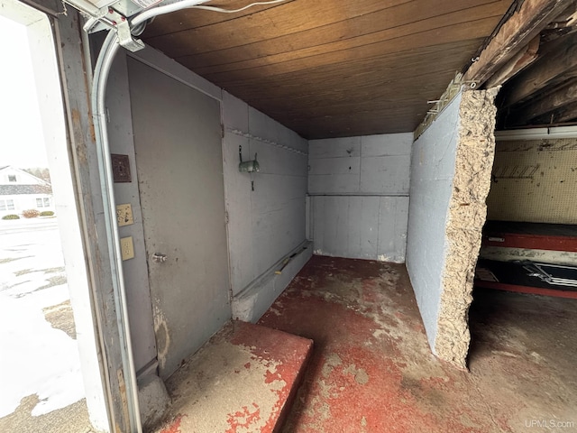 basement featuring wooden ceiling