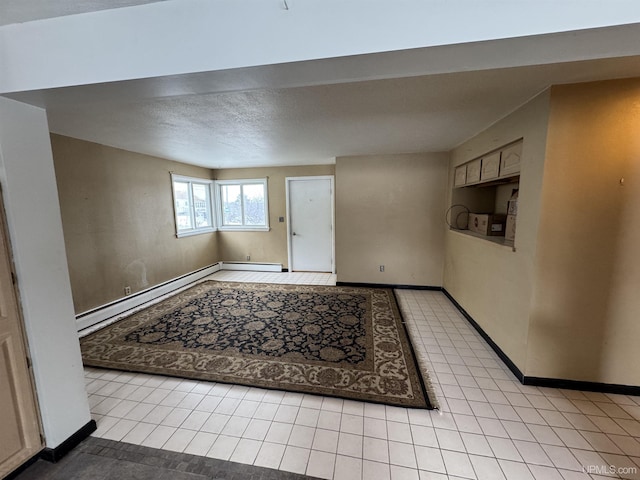 tiled entrance foyer with a baseboard heating unit