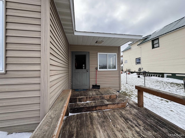 view of snow covered property entrance