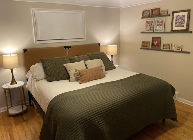 bedroom with wood-type flooring