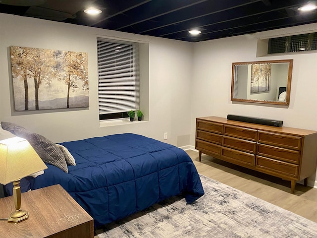 bedroom with light hardwood / wood-style floors