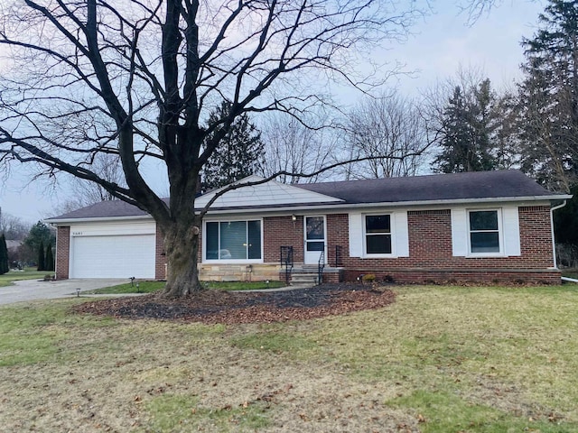 single story home featuring a garage and a front lawn