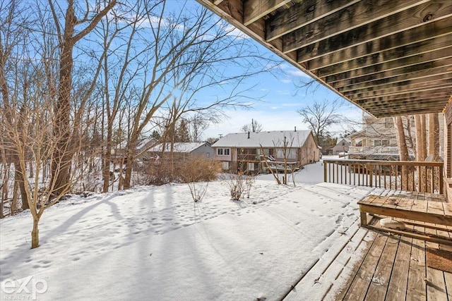 view of snow covered deck