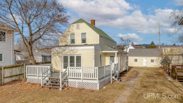 back of house with a wooden deck