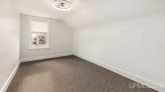 additional living space with carpet and vaulted ceiling