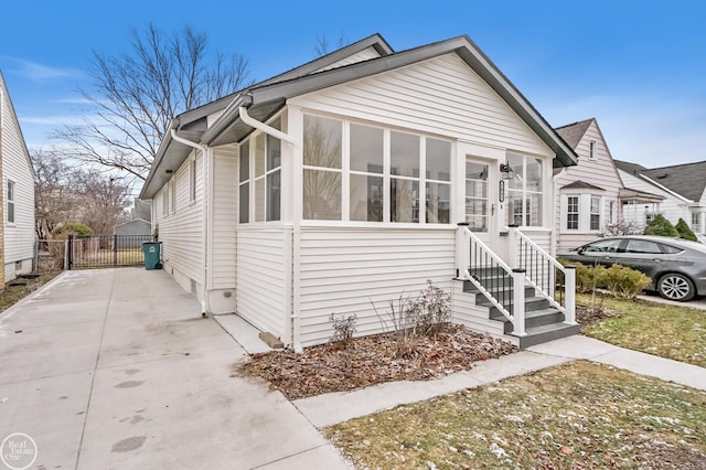 view of front of property featuring a sunroom