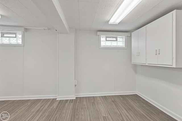 basement featuring light wood-type flooring