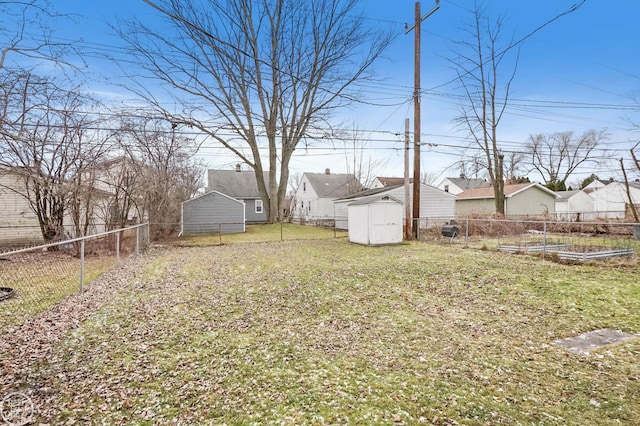 view of yard with a storage unit