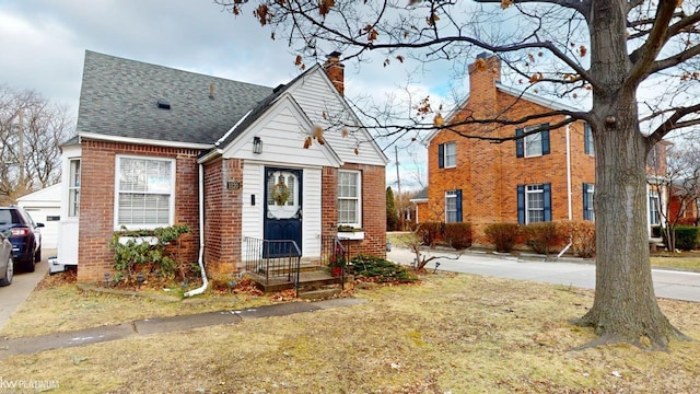 view of front of home with a front lawn and a garage