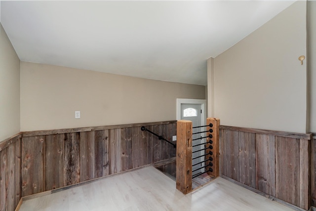 stairs with hardwood / wood-style flooring