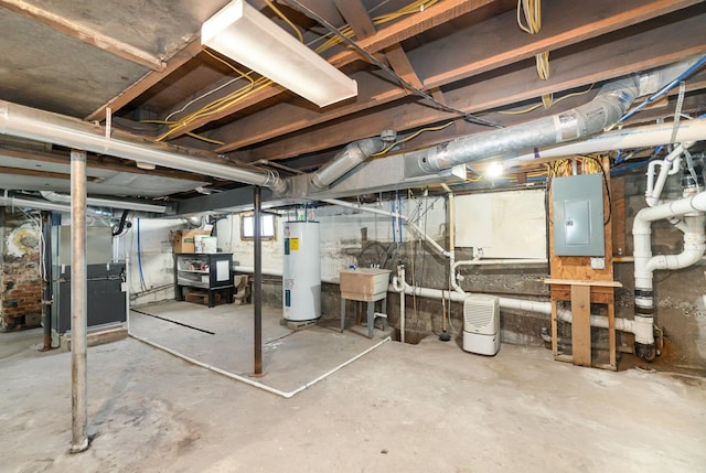 basement featuring heating unit, sink, electric panel, and water heater