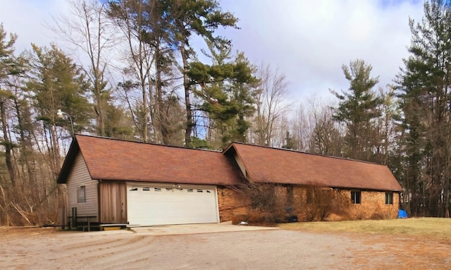 single story home with a garage