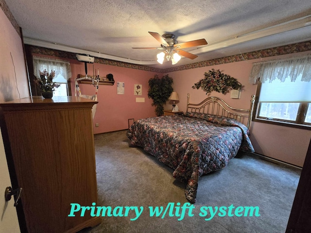 bedroom with carpet flooring, ceiling fan, and a textured ceiling