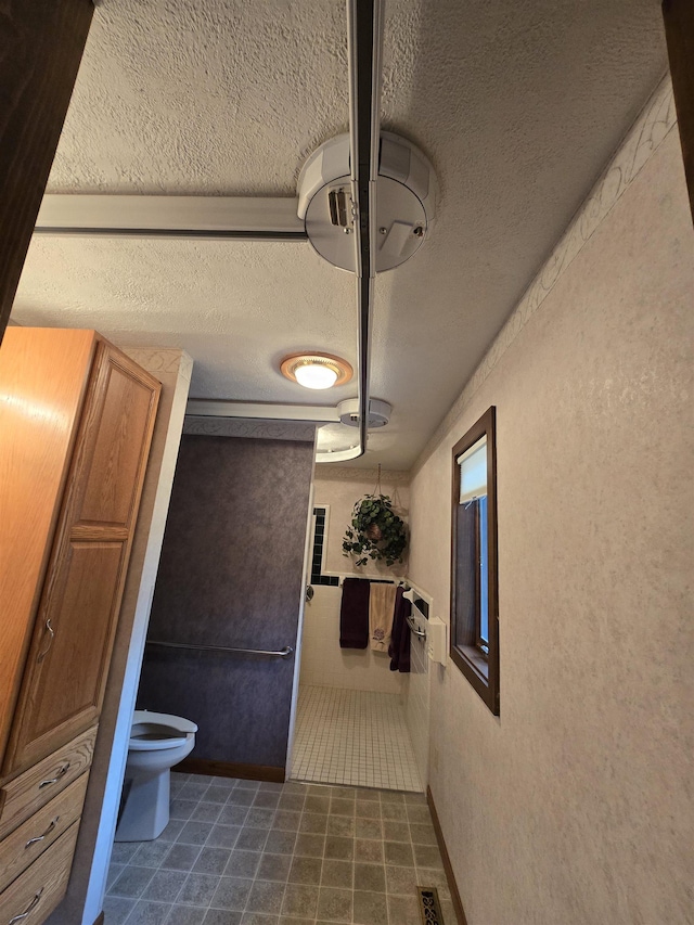 bathroom with a textured ceiling