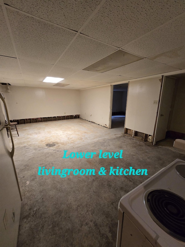 basement featuring a paneled ceiling