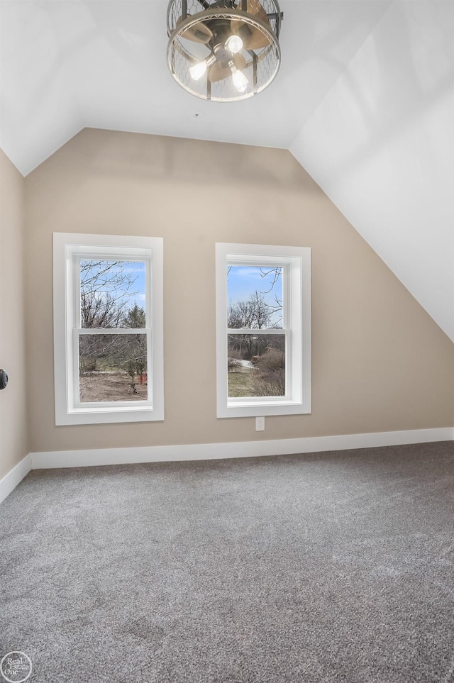 bonus room featuring lofted ceiling, a wealth of natural light, and carpet