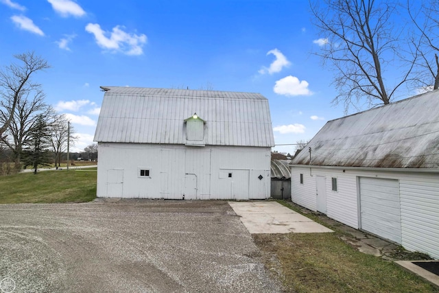 exterior space with an outdoor structure and a yard