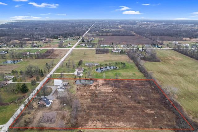 bird's eye view featuring a water view and a rural view