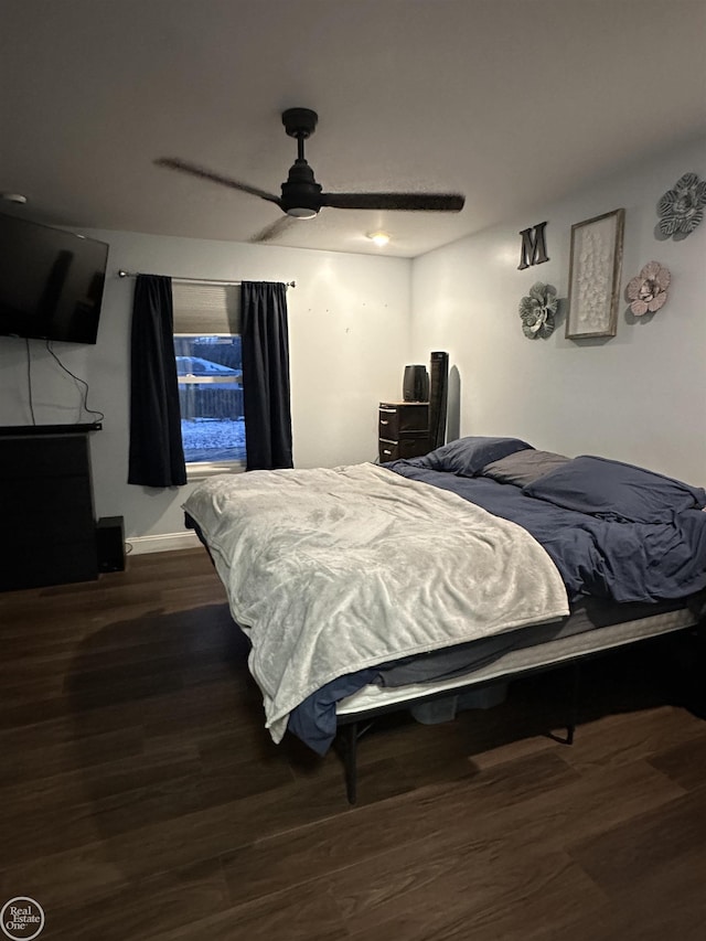 bedroom featuring dark hardwood / wood-style floors and ceiling fan