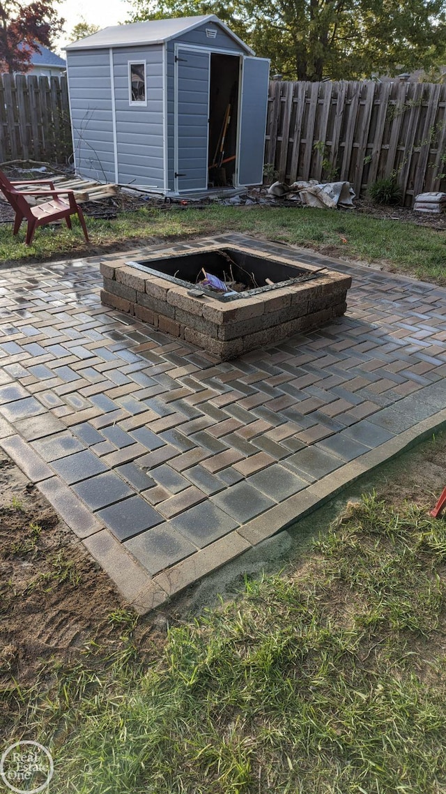 view of patio with a shed