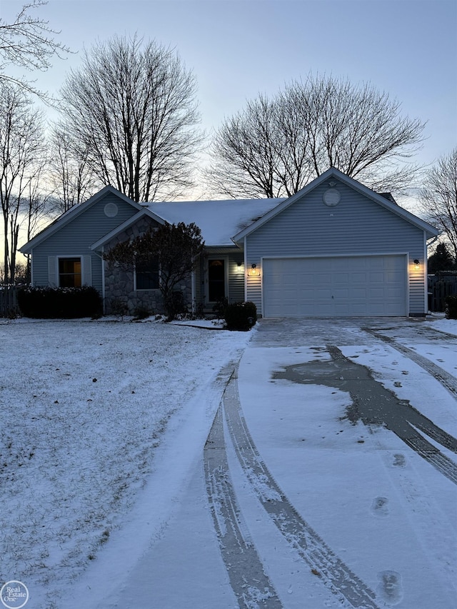 single story home featuring a garage