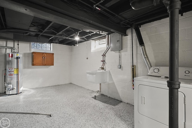 basement with electric panel, sink, and gas water heater