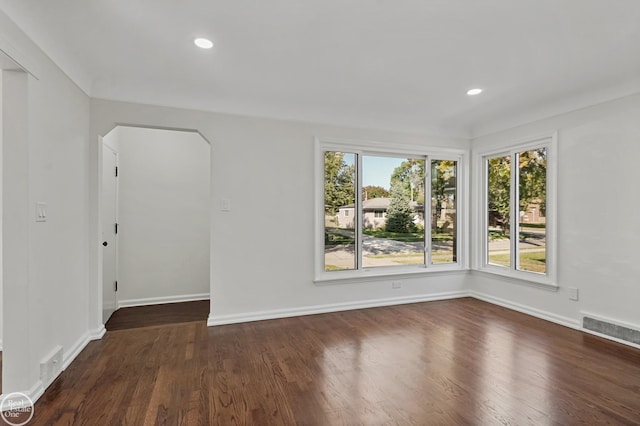 unfurnished room featuring dark hardwood / wood-style floors