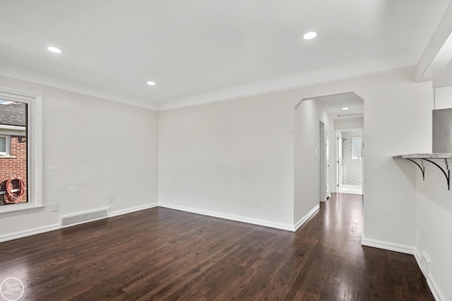 spare room with dark hardwood / wood-style floors