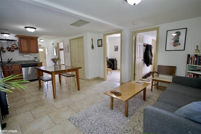 tiled living room featuring sink