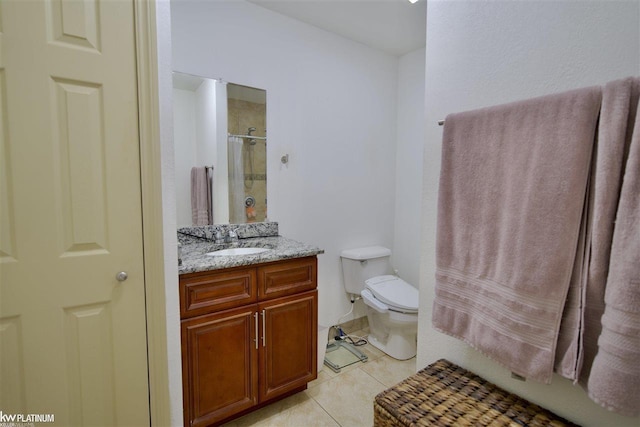 bathroom with tile patterned flooring, vanity, a shower with shower curtain, and toilet