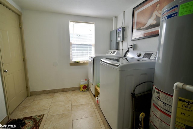 laundry room with washer and clothes dryer, light tile patterned floors, and water heater