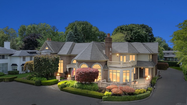 view of front of property with a balcony