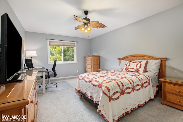 bedroom with ceiling fan and light colored carpet