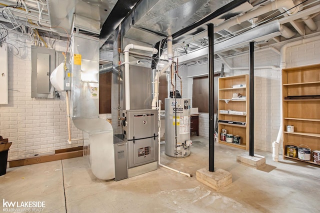 utility room featuring gas water heater and electric panel