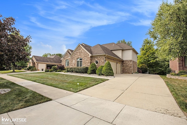 view of front of house featuring a garage and a front yard