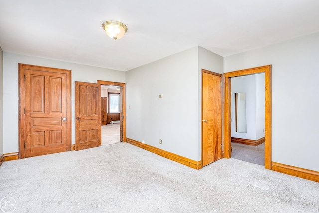 unfurnished bedroom featuring light colored carpet