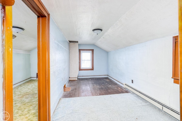 bonus room featuring wood-type flooring, a baseboard radiator, and vaulted ceiling