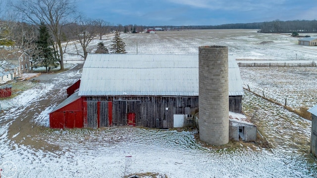 exterior space featuring a rural view and an outbuilding