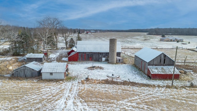 snowy aerial view featuring a rural view