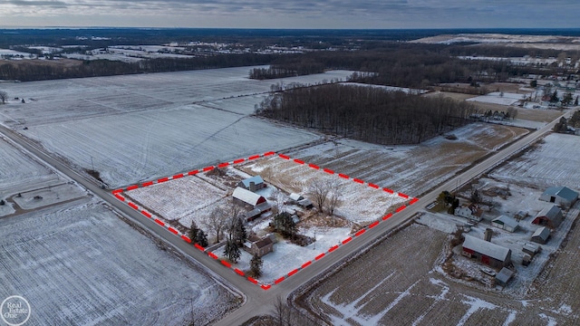 snowy aerial view featuring a rural view