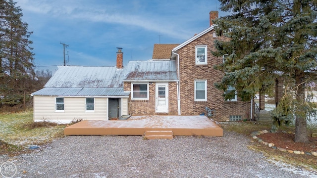 rear view of house featuring a deck